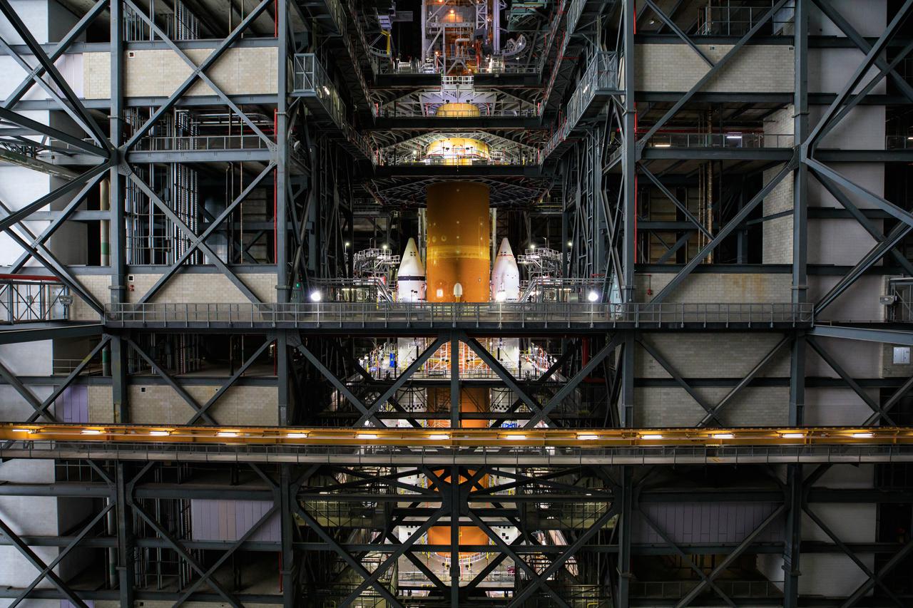 Seen here is the launch vehicle stage adapter (LVSA) for NASA’s Space Launch System (SLS) rocket atop the massive SLS core stage on the mobile launcher in the agency’s Vehicle Assembly Building (VAB) at NASA’s Kennedy Space Center in Florida on June 24, 2021. Teams with NASA’s Exploration Ground Systems and contractor Jacobs used one of five VAB cranes to lift the adapter almost 250-feet in the air and then slowly lower it on to the core stage earlier this week. The LVSA arrived at Kennedy from the agency’s Marshall Space Flight Center in Huntsville, Alabama, in July 2020 and has remained in the VAB for processing. During integration, known as “stacking,” the LVSA is bolted to the forward skirt of the core stage, connecting the core stage and the interim cryogenic propulsion stage in preparation for the first flight of the rocket and the Orion spacecraft during Artemis I. The ICPS’s RL10 engine will fit down inside the LVSA, which protects the engine during launch. The first in a series of increasingly complex missions, Artemis I will test SLS and the Orion spacecraft as an integrated system prior to crewed flights in which NASA will land the first woman and person of color on the Moon.