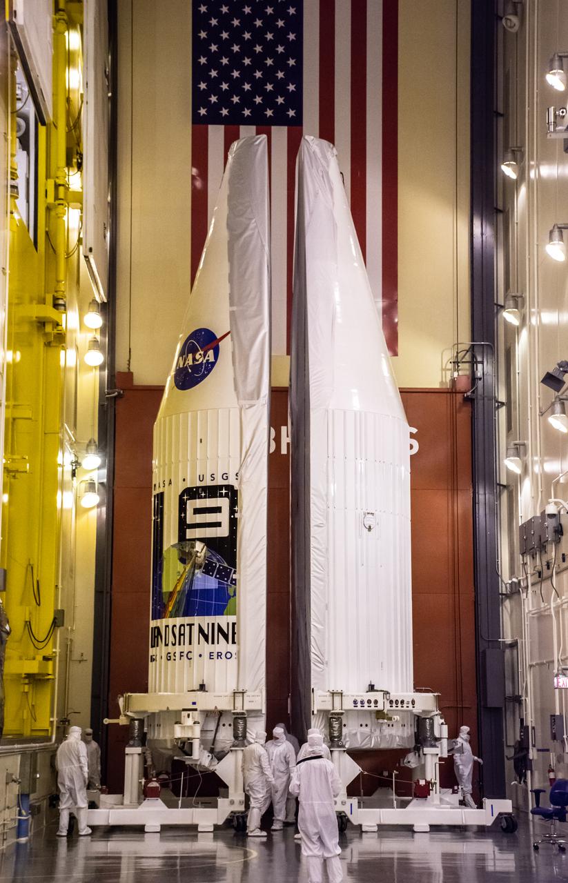 Inside the Integrated Processing Facility at Vandenberg Space Force Base in California, United Launch Alliance (ULA) technicians remove the contamination barrier from the two ULA Atlas V rocket payload fairings for NASA’s Landsat 9 satellite on June 23, 2021. The fairings will encapsulate the satellite for its launch atop the Atlas V from Vandenberg in September 2021. The launch is being managed by NASA’s Launch Services Program based at Kennedy Space Center in Florida. Landsat 9 will continue the nearly 50-year legacy of previous Landsat missions. It will monitor key natural and economic resources from orbit. Landsat 9 is managed by the agency’s Goddard Space Flight Center in Greenbelt, Maryland. It will carry two instruments: the Operational Land Imager 2, which collects images of Earth’s landscapes in visible, near-infrared and shortwave infrared light, and the Thermal Infrared Sensor 2, which measures the temperature of land surfaces. Like its predecessors, Landsat 9 is a joint mission between NASA and the U.S. Geological Survey. 
