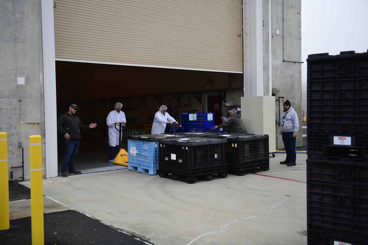 United Launch Alliance (ULA) technicians move containers of electrical ground support equipment for NASA’s Landsat 9 mission inside the Integrated Processing Facility at Vandenberg Space Force Base in California, on June 29, 2021. The Landsat 9 mission will launch atop a ULA Atlas V rocket from Vandenberg in September 2021. The launch is being managed by NASA’s Launch Services Program based at Kennedy Space Center. The Landsat 9 satellite will continue the nearly 50-year legacy of previous Landsat missions. It will monitor key natural and economic resources from orbit. Landsat 9 is managed by the agency’s Goddard Space Flight Center in Greenbelt, Maryland. The satellite will carry two instruments: the Operational Land Imager 2, which collects images of Earth’s landscapes in visible, near infrared and shortwave infrared light, and the Thermal Infrared Sensor 2, which measures the temperature of land surfaces. Like its predecessors, Landsat 9 is a joint mission between NASA and the U.S. Geological Survey. 