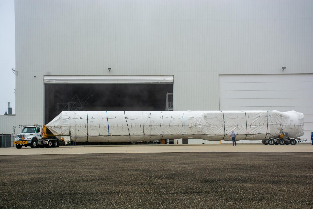 The United Launch Alliance (ULA) Atlas V booster for NASA’s Landsat 9 mission is transported by flatbed truck to the Horizontal Integration Facility at Vandenberg Space Force Base in California, on June 29, 2021. The Landsat 9 mission will launch atop a ULA Atlas V rocket from Vandenberg in September 2021. The launch is being managed by NASA’s Launch Services Program based at Kennedy Space Center. The Landsat 9 satellite will continue the nearly 50-year legacy of previous Landsat missions. It will monitor key natural and economic resources from orbit. Landsat 9 is managed by the agency’s Goddard Space Flight Center in Greenbelt, Maryland. The satellite will carry two instruments: the Operational Land Imager 2, which collects images of Earth’s landscapes in visible, near infrared and shortwave infrared light, and the Thermal Infrared Sensor 2, which measures the temperature of land surfaces. Like its predecessors, Landsat 9 is a joint mission between NASA and the U.S. Geological Survey.