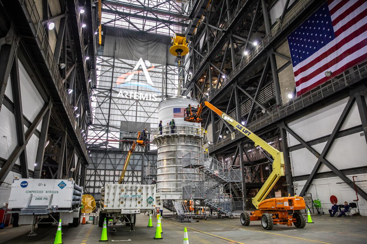 Teams with NASA’s Exploration Ground Systems and contractor Jacobs integrate the interim cryogenic propulsion stage (ICPS) for NASA’s Space Launch System (SLS) rocket with the launch vehicle stage adapter (LVSA) atop the massive SLS core stage in the agency’s Vehicle Assembly Building (VAB) at NASA’s Kennedy Space Center in Florida on July 5, 2021. The ICPS is a liquid oxygen and liquid hydrogen-based system that will fire its RL 10 engine to give the Orion spacecraft the big in-space push needed to fly tens of thousands of miles beyond the Moon. The next component to be stacked on top of ICPS will be the Orion stage adapter, which will connect the ICPS with the spacecraft. Through Artemis, NASA will send the first woman and the first person of color to the lunar surface, as well as establish a sustainable presence on and around the Moon. As the first in an increasingly complex set of missions, Artemis I will test SLS and Orion as an integrated system prior to crewed flights to the Moon.