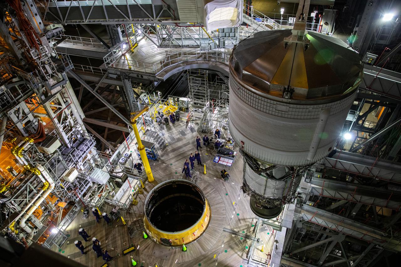Teams with NASA’s Exploration Ground Systems and contractor Jacobs integrate the interim cryogenic propulsion stage (ICPS) for NASA’s Space Launch System (SLS) rocket with the launch vehicle stage adapter (LVSA) atop the massive SLS core stage in the agency’s Vehicle Assembly Building (VAB) at NASA’s Kennedy Space Center in Florida on July 5, 2021. The ICPS is a liquid oxygen and liquid hydrogen-based system that will fire its RL 10 engine to give the Orion spacecraft the big in-space push needed to fly tens of thousands of miles beyond the Moon. The next component to be stacked on top of ICPS will be the Orion stage adapter, which will connect the ICPS with the spacecraft. Through Artemis, NASA will send the first woman and the first person of color to the lunar surface, as well as establish a sustainable presence on and around the Moon. As the first in an increasingly complex set of missions, Artemis I will test SLS and Orion as an integrated system prior to crewed flights to the Moon.