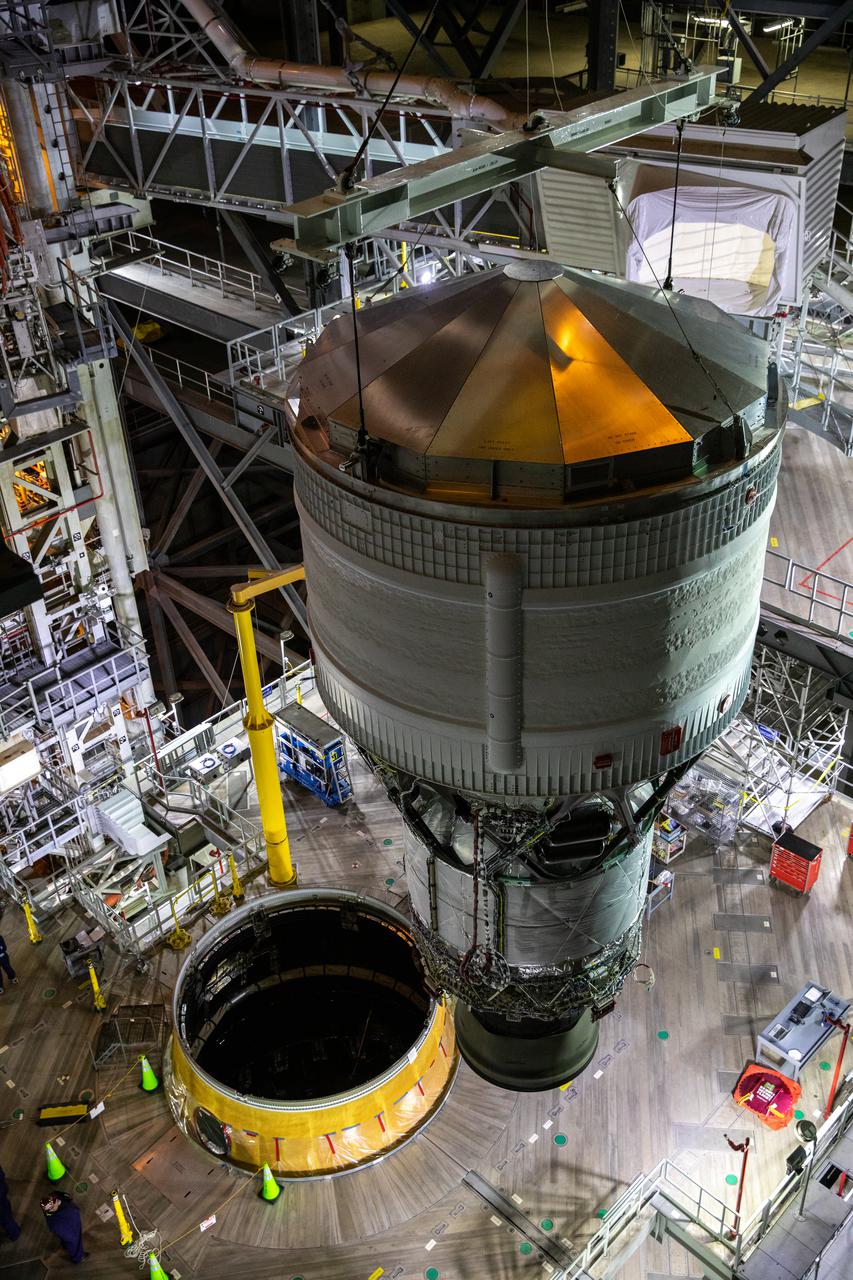 Teams with NASA’s Exploration Ground Systems and contractor Jacobs integrate the interim cryogenic propulsion stage (ICPS) for NASA’s Space Launch System (SLS) rocket with the launch vehicle stage adapter (LVSA) atop the massive SLS core stage in the agency’s Vehicle Assembly Building (VAB) at NASA’s Kennedy Space Center in Florida on July 5, 2021. The ICPS is a liquid oxygen and liquid hydrogen-based system that will fire its RL 10 engine to give the Orion spacecraft the big in-space push needed to fly tens of thousands of miles beyond the Moon. The next component to be stacked on top of ICPS will be the Orion stage adapter, which will connect the ICPS with the spacecraft. Through Artemis, NASA will send the first woman and the first person of color to the lunar surface, as well as establish a sustainable presence on and around the Moon. As the first in an increasingly complex set of missions, Artemis I will test SLS and Orion as an integrated system prior to crewed flights to the Moon.