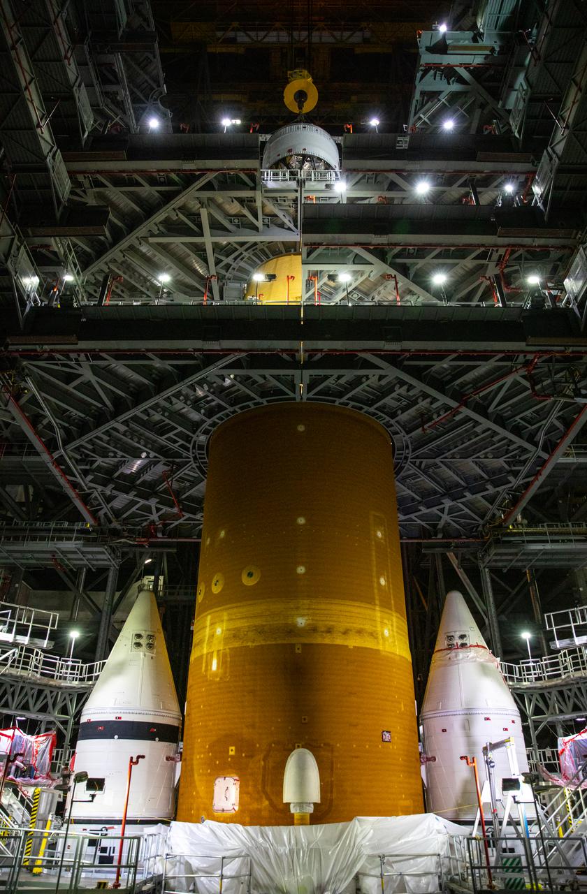 Teams with NASA’s Exploration Ground Systems and contractor Jacobs integrate the interim cryogenic propulsion stage (ICPS) for NASA’s Space Launch System (SLS) rocket with the launch vehicle stage adapter (LVSA) atop the massive SLS core stage in the agency’s Vehicle Assembly Building (VAB) at NASA’s Kennedy Space Center in Florida on July 5, 2021. The ICPS is a liquid oxygen and liquid hydrogen-based system that will fire its RL 10 engine to give the Orion spacecraft the big in-space push needed to fly tens of thousands of miles beyond the Moon. The next component to be stacked on top of ICPS will be the Orion stage adapter, which will connect the ICPS with the spacecraft. Through Artemis, NASA will send the first woman and the first person of color to the lunar surface, as well as establish a sustainable presence on and around the Moon. As the first in an increasingly complex set of missions, Artemis I will test SLS and Orion as an integrated system prior to crewed flights to the Moon.