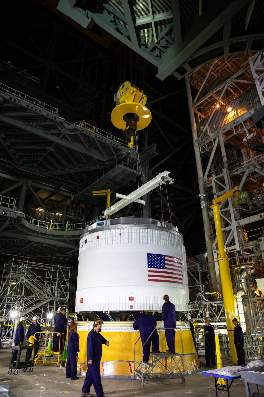 Teams with NASA’s Exploration Ground Systems and contractor Jacobs integrate the interim cryogenic propulsion stage (ICPS) for NASA’s Space Launch System (SLS) rocket with the launch vehicle stage adapter (LVSA) atop the massive SLS core stage in the agency’s Vehicle Assembly Building (VAB) at NASA’s Kennedy Space Center in Florida on July 5, 2021. The ICPS is a liquid oxygen and liquid hydrogen-based system that will fire its RL 10 engine to give the Orion spacecraft the big in-space push needed to fly tens of thousands of miles beyond the Moon. The next component to be stacked on top of ICPS will be the Orion stage adapter, which will connect the ICPS with the spacecraft. Through Artemis, NASA will send the first woman and the first person of color to the lunar surface, as well as establish a sustainable presence on and around the Moon. As the first in an increasingly complex set of missions, Artemis I will test SLS and Orion as an integrated system prior to crewed flights to the Moon.