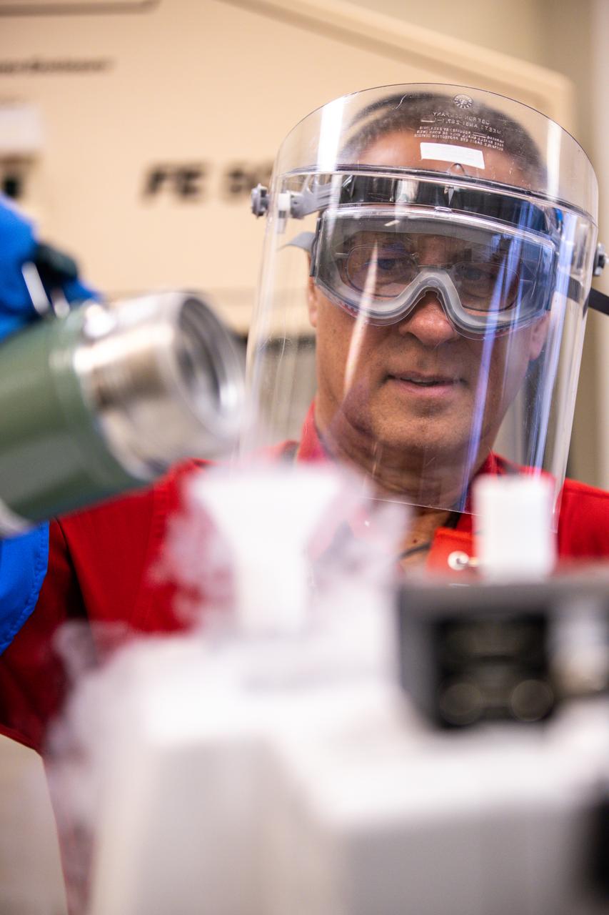 Lead chemist Philip Howard pours liquid nitrogen into the Fourier-transform infrared spectrometer to cool the detector in NASA Engineering’s Analytical Laboratories at Kennedy Space Center in Florida on July 7, 2021. One of seven branches in the NASA Laboratories, Development, and Testing Division, the Analytical Laboratories branch provides microscopic imagery and analysis through the use of a wide variety of microscopic techniques to identify contaminants and other urgent problems associated with aerospace flight hardware, ground support equipment, and related facilities. 