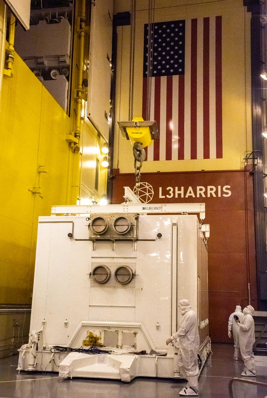 Technicians prepare to remove the satellite for the Landsat 9 mission from its shipping container following its arrival at Vandenberg Space Force Base in California on July 7, 2021. The Landsat 9 mission will launch atop a United Launch Alliance Atlas V rocket from Vandenberg in September 2021. The launch is being managed by NASA’s Launch Services Program based at Kennedy Space Center in Florida, America’s multi-user spaceport. The Landsat 9 satellite will continue the nearly 50-year legacy of previous Landsat missions. It will monitor key natural and economic resources from orbit. Landsat 9 is managed by the agency’s Goddard Space Flight Center in Greenbelt, Maryland. The satellite will carry two instruments: the Operational Land Imager 2, which collects images of Earth’s landscapes in visible, near infrared and shortwave infrared light, and the Thermal Infrared Sensor 2, which measures the temperature of land surfaces. Like its predecessors, Landsat 9 is a joint mission between NASA and the U.S. Geological Survey.