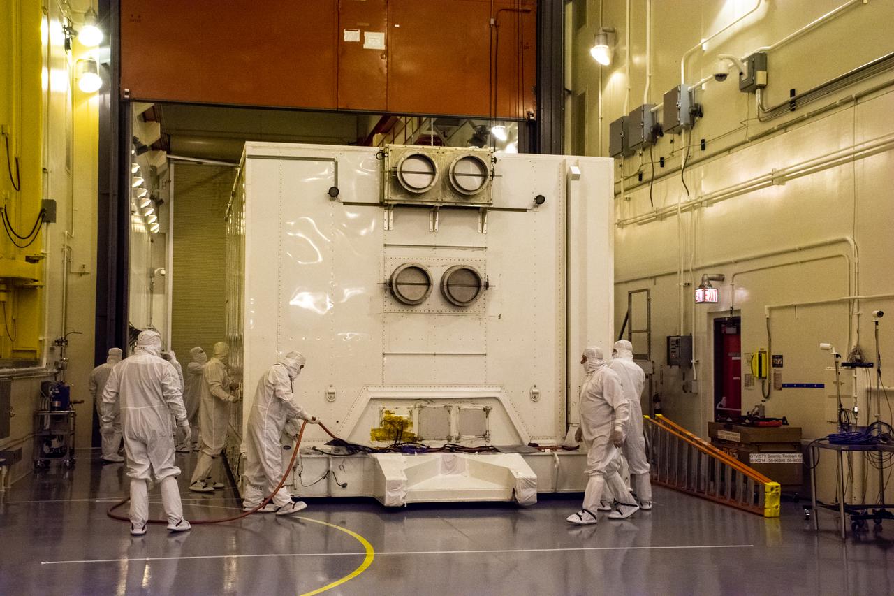 Technicians move the shipping container, carrying the satellite for the Landsat 9 mission, into the Integrated Processing Facility following its arrival at Vandenberg Space Force Base in California on July 7, 2021. The Landsat 9 mission will launch atop a United Launch Alliance Atlas V rocket from Vandenberg in September 2021. The launch is being managed by NASA’s Launch Services Program based at Kennedy Space Center in Florida, America’s multi-user spaceport. The Landsat 9 satellite will continue the nearly 50-year legacy of previous Landsat missions. It will monitor key natural and economic resources from orbit. Landsat 9 is managed by the agency’s Goddard Space Flight Center in Greenbelt, Maryland. The satellite will carry two instruments: the Operational Land Imager 2, which collects images of Earth’s landscapes in visible, near infrared and shortwave infrared light, and the Thermal Infrared Sensor 2, which measures the temperature of land surfaces. Like its predecessors, Landsat 9 is a joint mission between NASA and the U.S. Geological Survey.