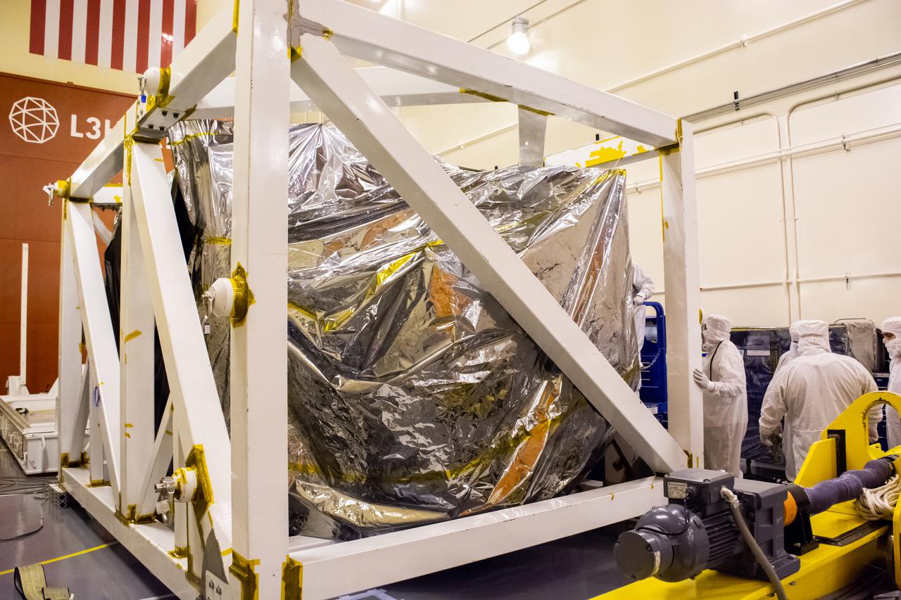 Technicians check the Landsat 9 spacecraft secured in its protective stand on the floor of the Integrated Processing Facility at Vandenberg Space Force Base in California, on July 8, 2021. Landsat 9 is being prepared for its launch atop the ULA Atlas V from Vandenberg in September 2021. The launch is being managed by NASA’s Launch Services Program based at Kennedy Space Center in Florida. Landsat 9 will continue the nearly 50-year legacy of previous Landsat missions. It will monitor key natural and economic resources from orbit. Landsat 9 is managed by the agency’s Goddard Space Flight Center in Greenbelt, Maryland. It will carry two instruments: the Operational Land Imager 2, which collects images of Earth’s landscapes in visible, near-infrared and shortwave infrared light, and the Thermal Infrared Sensor 2, which measures the temperature of land surfaces. Like its predecessors, Landsat 9 is a joint mission between NASA and the U.S. Geological Survey.