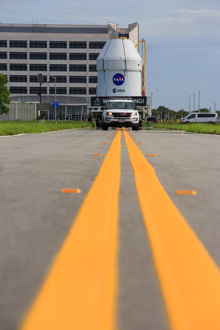 The Orion spacecraft for the Artemis I mission is transported from Kennedy Space Center’s Multi-Payload Processing Facility to the Florida spaceport’s Launch Abort System Facility on July 10, 2021. Teams with Exploration Ground Systems and contractor Jacobs will integrate components of the launch abort system onto the spacecraft. Launching later this year, Artemis I will be a test of the Orion spacecraft and SLS rocket as an integrated system ahead of crewed flights to the Moon.