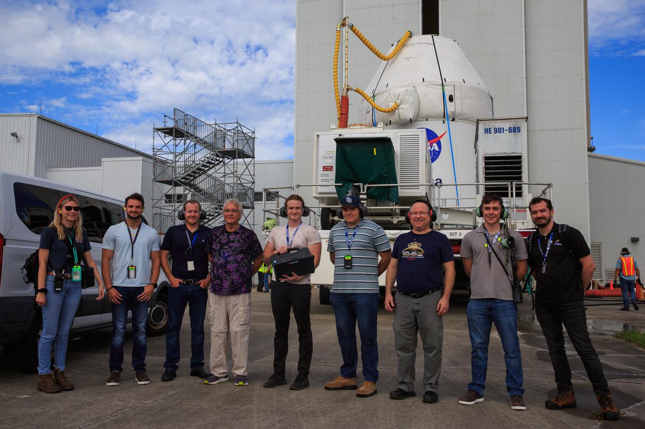 Teams from Kennedy’s Exploration Ground Systems and contractor Jacobs pose as the Orion spacecraft for the Artemis I mission is transported to the Florida spaceport’s Launch Abort System Facility on July 10, 2021. They will integrate components of the launch abort system onto the spacecraft. Launching later this year, Artemis I will be a test of the Orion spacecraft and SLS rocket as an integrated system ahead of crewed flights to the Moon.