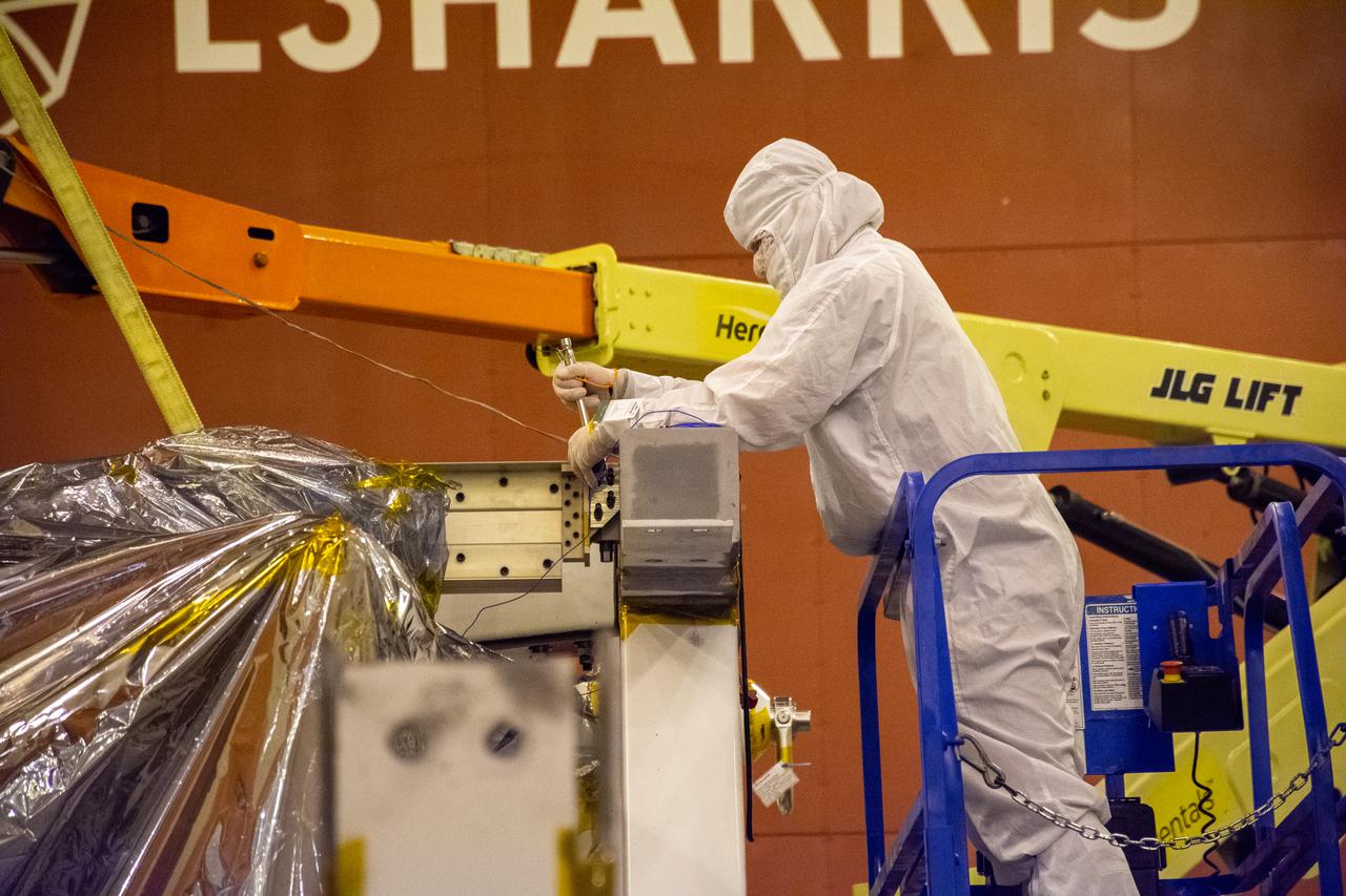 The Landsat 9 spacecraft (observatory) undergoes breakover operations inside the Integrated Processing Facility at Vandenberg Space Force Base in California. 