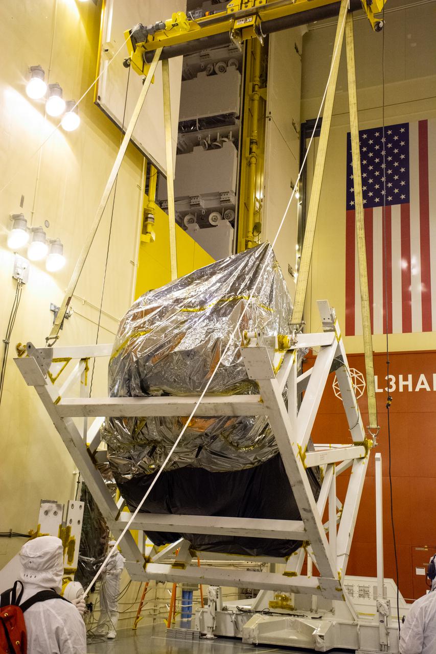 Inside the Integrated Processing Facility at Vandenberg Space Force Base in California, NASA’s Landsat 9 observatory is moved to the vertical position and ready to be rotated on July 11, 2021. Landsat 9 will launch on an Atlas V rocket from Space Launch Complex 3 at Vandenberg in September 2021. The launch is being managed by NASA’s Launch Services Program based at Kennedy Space Center, America’s multiuser spaceport. The Landsat 9 satellite will continue the nearly 50-year legacy of previous Landsat missions. It will monitor key natural and economic resources from orbit. Landsat 9 is managed by the agency’s Goddard Space Flight Center in Greenbelt, Maryland. The satellite will carry two instruments: the Operational Land Imager 2, which collects images of Earth’s landscapes in visible, near infrared and shortwave infrared light, and the Thermal Infrared Sensor 2, which measures the temperature of land surfaces. Like its predecessors, Landsat 9 is a joint mission between NASA and the U.S. Geological Survey.