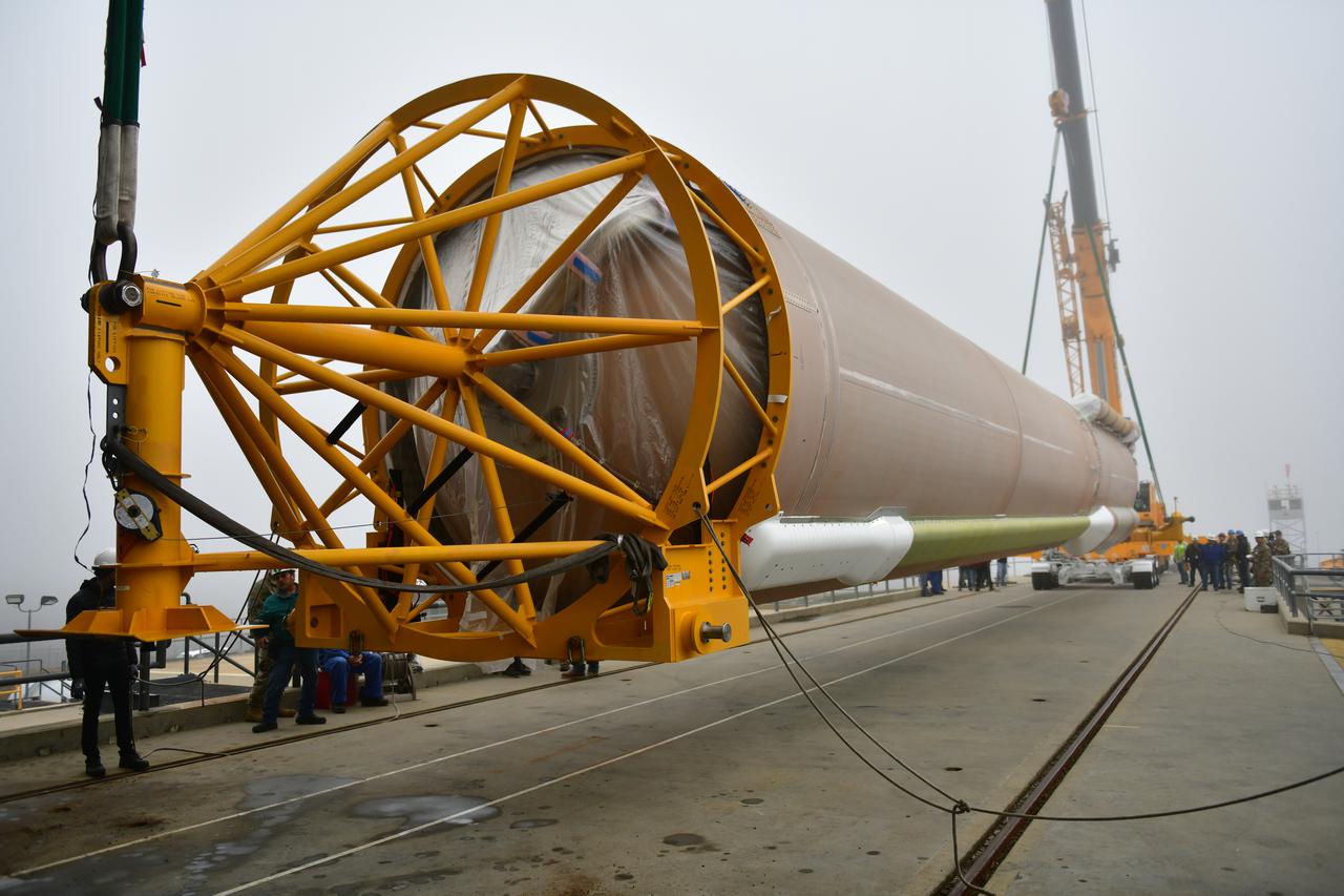 A special lifting device is attached to the United Launch Alliance Atlas V booster for NASA’s Landsat 9 mission at Space Launch Complex 3 at Vandenberg Space Force Base in California, on July 13, 2021. The booster will be lifted and moved into the Vertical Integration Facility. The Landsat 9 mission will launch atop the Atlas V rocket from Vandenberg in September 2021. The launch is being managed by NASA’s Launch Services Program based at Kennedy Space Center. The Landsat 9 satellite will continue the nearly 50-year legacy of previous Landsat missions. It will monitor key natural and economic resources from orbit. Landsat 9 is managed by the agency’s Goddard Space Flight Center in Greenbelt, Maryland. The satellite will carry two instruments: the Operational Land Imager 2, which collects images of Earth’s landscapes in visible, near infrared and shortwave infrared light, and the Thermal Infrared Sensor 2, which measures the temperature of land surfaces. Like its predecessors, Landsat 9 is a joint mission between NASA and the U.S. Geological Survey. 
