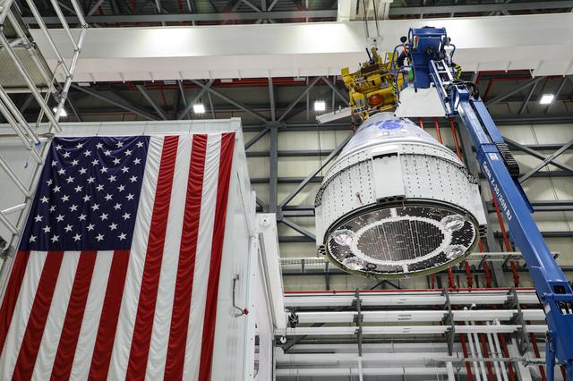NASA image: OFT-2: CST-100 Starliner is hoisted in the C3PF