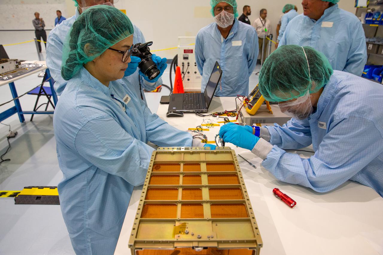 The Near-Earth Asteroid Scout team prepares their secondary payload for installation in the Space Launch System rocket’s Orion stage adapter at NASA’s Kennedy Space Center in Florida. NEA Scout will be deployed and go to an asteroid after the Orion spacecraft separates from the Space Launch System rocket and heads to the Moon during the Artemis I mission.