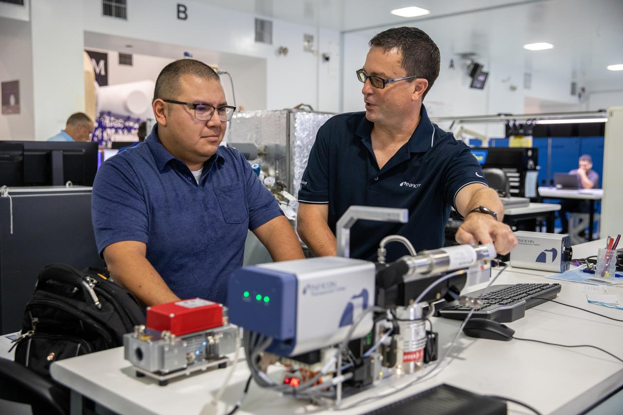 Kennedy Space Center employee Roberto Aguilar Ayala, left, and Ken Wright of INFICON work with MSolo (Mass Spectrometer Observing Lunar Operations) test hardware at Kennedy Space Center in Florida on July 13, 2021. MSolo is a commercial off-the-shelf mass spectrometer modified by the team at Kennedy to work in the harsh, rigorous conditions of the Moon. MSolo is heading to the Moon on four of NASA’s Commercial Lunar Payload Services initiative or CLPS missions, including the Polar Resources Ice Mining Experiment-1 (PRIME-1) and NASA’s Volatiles Investigating Polar Exploration Rover, or VIPER. Kennedy is working in partnership with INFICON, of Syracuse, New York, to develop the mass spectrometer.