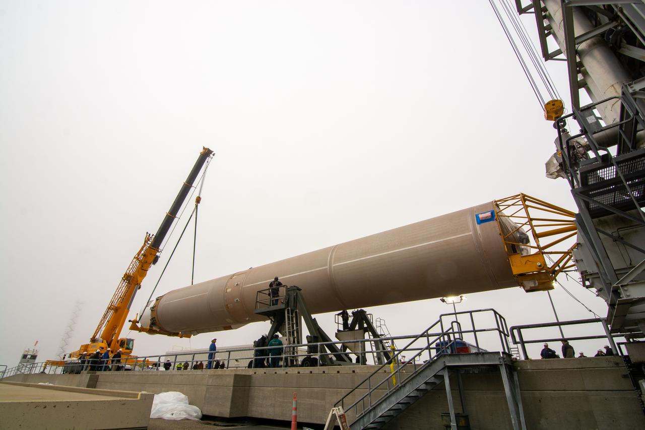 The United Launch Alliance Atlas V booster for NASA’s Landsat 9 mission is lifted by crane and special lifting device for transfer into the Vertical Integration Facility at Space Launch Complex 3 at Vandenberg Space Force Base in California, on July 13, 2021. The Landsat 9 mission will launch atop the Atlas V rocket from Vandenberg in September 2021. The launch is being managed by NASA’s Launch Services Program based at Kennedy Space Center. The Landsat 9 satellite will continue the nearly 50-year legacy of previous Landsat missions. It will monitor key natural and economic resources from orbit. Landsat 9 is managed by the agency’s Goddard Space Flight Center in Greenbelt, Maryland. The satellite will carry two instruments: the Operational Land Imager 2, which collects images of Earth’s landscapes in visible, near infrared and shortwave infrared light, and the Thermal Infrared Sensor 2, which measures the temperature of land surfaces. Like its predecessors, Landsat 9 is a joint mission between NASA and the U.S. Geological Survey. 