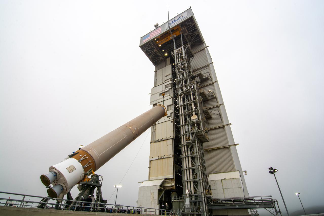 The United Launch Alliance Atlas V booster for NASA’s Landsat 9 mission is lifted by crane and a special lifting advice for transfer into the Vertical Integration Facility at Space Launch Complex 3 at Vandenberg Space Force Base in California, on July 13, 2021. The Landsat 9 mission will launch atop the Atlas V rocket from Vandenberg in September 2021. The launch is being managed by NASA’s Launch Services Program based at Kennedy Space Center. The Landsat 9 satellite will continue the nearly 50-year legacy of previous Landsat missions. It will monitor key natural and economic resources from orbit. Landsat 9 is managed by the agency’s Goddard Space Flight Center in Greenbelt, Maryland. The satellite will carry two instruments: the Operational Land Imager 2, which collects images of Earth’s landscapes in visible, near infrared and shortwave infrared light, and the Thermal Infrared Sensor 2, which measures the temperature of land surfaces. Like its predecessors, Landsat 9 is a joint mission between NASA and the U.S. Geological Survey. 