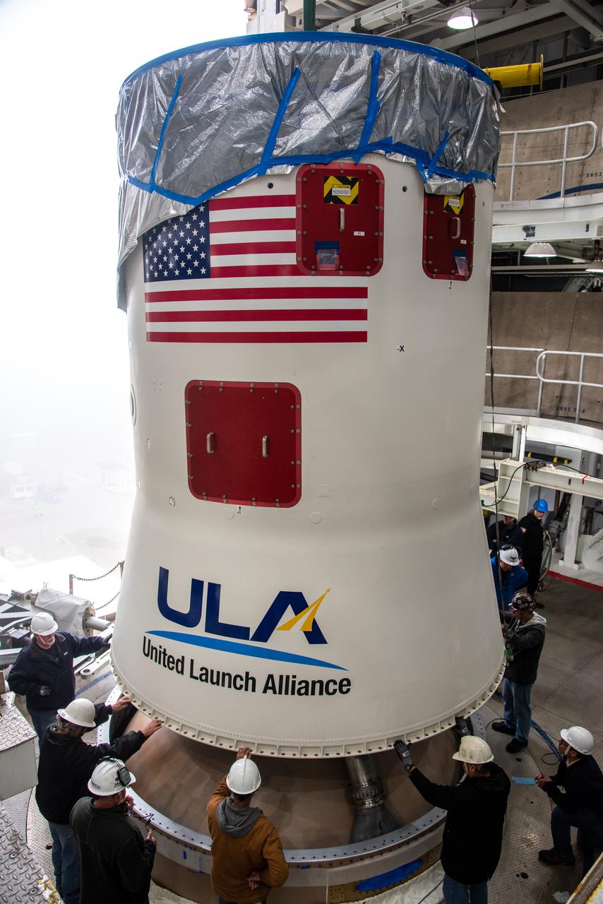 Inside the Vertical Integration Facility at Space Launch Complex 3 at Vandenberg Space Source Base in California, workers help secure the interstage and assembly second stage adapters to the Centaur second stage of the United Launch Alliance Atlas V rocket for NASA’s Landsat 9 mission on July 14, 2021. Landsat 9 will launch atop the Atlas V rocket from Vandenberg in September 2021. The launch is being managed by NASA’s Launch Services Program based at Kennedy Space Center, America’s multiuser spaceport. The Landsat 9 satellite will continue the nearly 50-year legacy of previous Landsat missions. It will monitor key natural and economic resources from orbit. Landsat 9 is managed by the agency’s Goddard Space Flight Center in Greenbelt, Maryland. The satellite will carry two instruments: the Operational Land Imager 2, which collects images of Earth’s landscapes in visible, near infrared and shortwave infrared light, and the Thermal Infrared Sensor 2, which measures the temperature of land surfaces. Like its predecessors, Landsat 9 is a joint mission between NASA and the U.S. Geological Survey. 