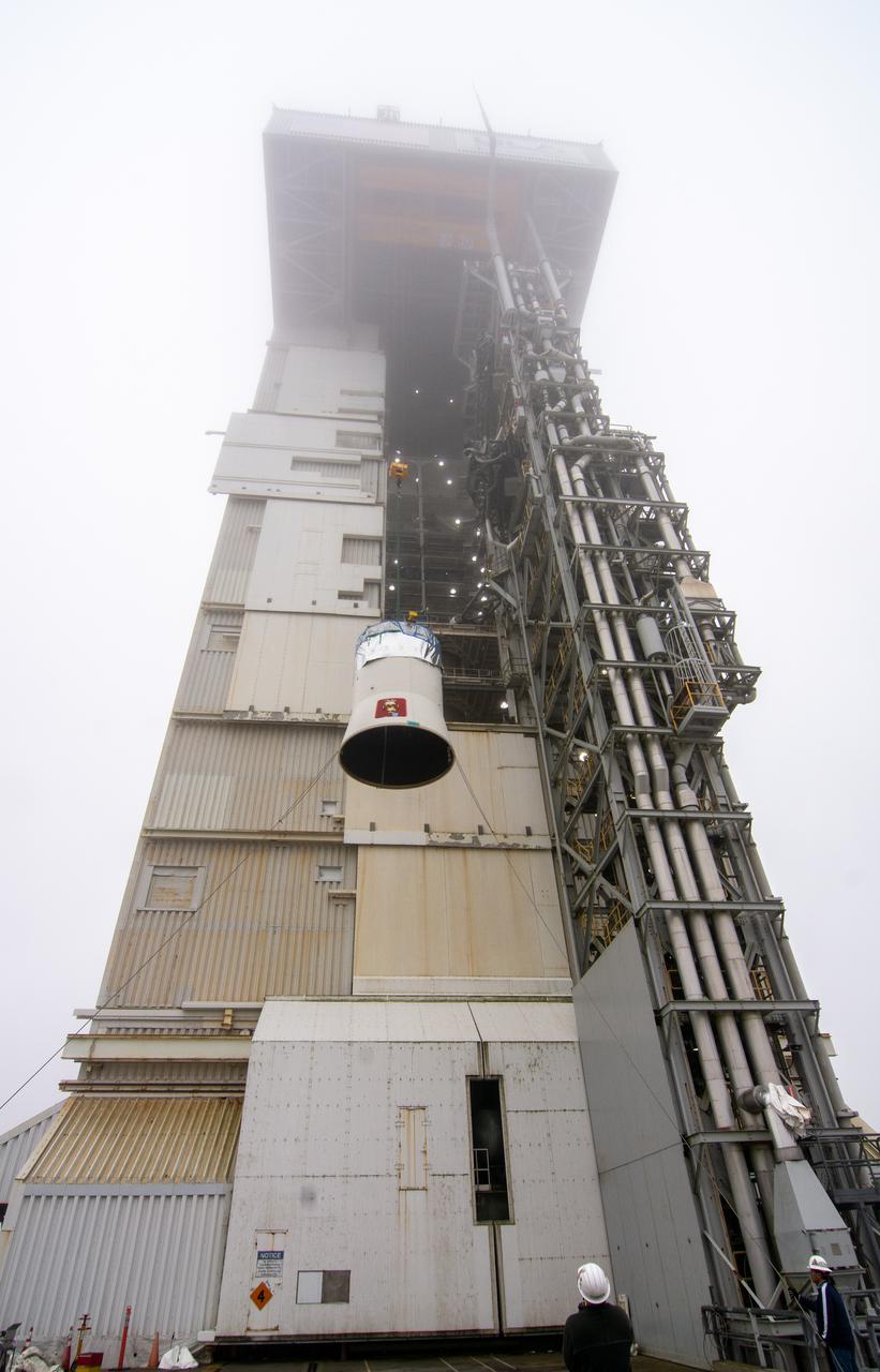 The interstage and assembly second stage adapters for the United Alliance Atlas V Centaur second stage for NASA’s Landsat 9 mission are lifted by crane at Space Launch Complex 3 at Vandenberg Space Force Base in California, on July 14, 2021. The adapters will be stacked atop the Centaur second stage in the Vertical Integration Facility near the launch pad. The Landsat 9 mission will launch atop the Atlas V rocket from Vandenberg in September 2021. The launch is being managed by NASA’s Launch Services Program based at Kennedy Space Center, America’s multiuser spaceport. The Landsat 9 satellite will continue the nearly 50-year legacy of previous Landsat missions. It will monitor key natural and economic resources from orbit. Landsat 9 is managed by the agency’s Goddard Space Flight Center in Greenbelt, Maryland. The satellite will carry two instruments: the Operational Land Imager 2, which collects images of Earth’s landscapes in visible, near infrared and shortwave infrared light, and the Thermal Infrared Sensor 2, which measures the temperature of land surfaces. Like its predecessors, Landsat 9 is a joint mission between NASA and the U.S. Geological Survey.