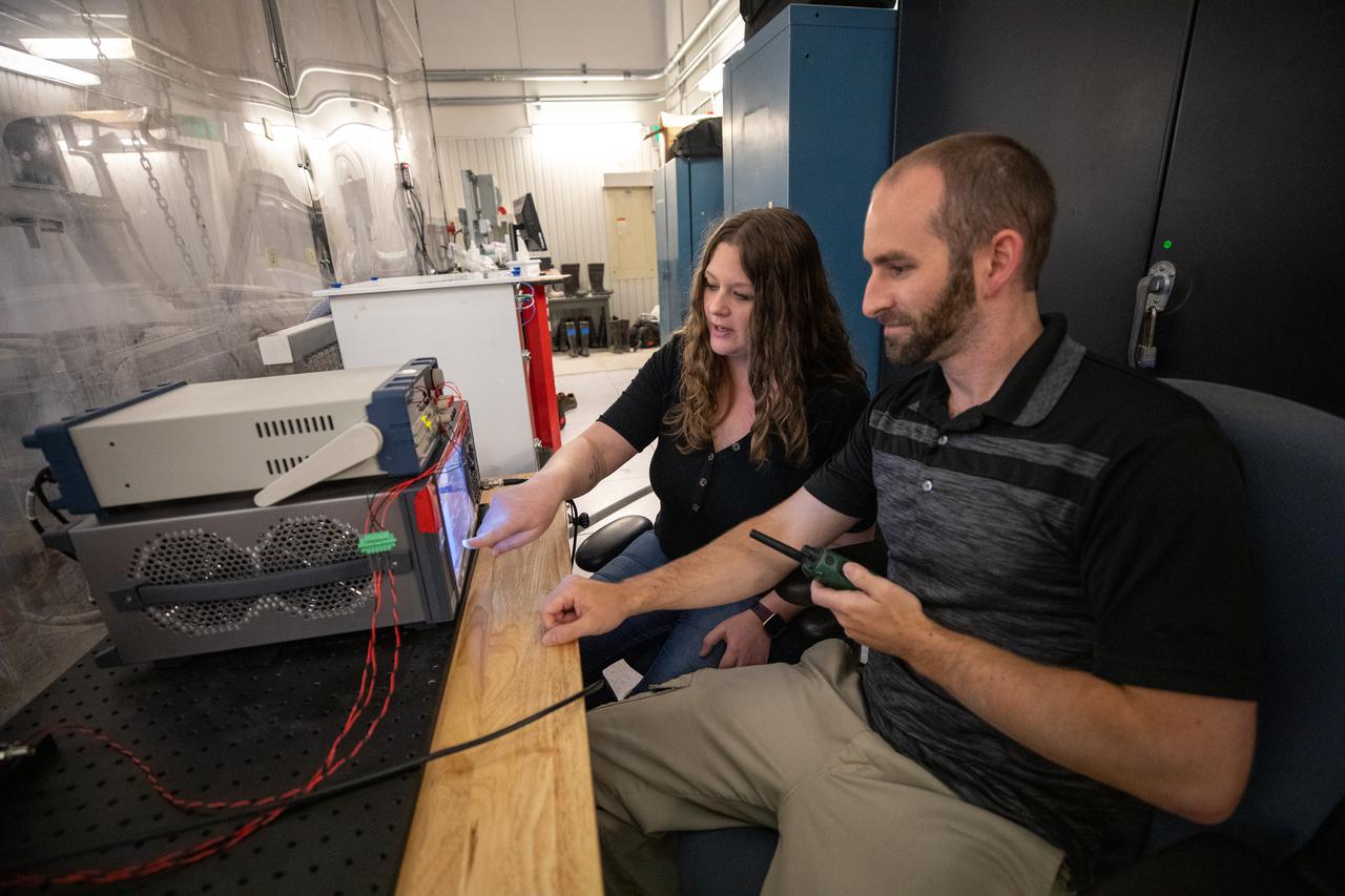 Beverly Kemmerer and Austin Adkins perform testing with a Millimeter Wave Doppler Radar at NASA’s Kennedy Space Center’s Granular Mechanics and Regolith Operations Lab on July 16, 2021. The testing at the Florida spaceport is part of a project to identify a suite of instrumentation capable of acquiring a comprehensive set of flight data from a lunar lander. Researchers at NASA will use that data to validate computational models being developed to predict plume surface interaction effects on the Moon.