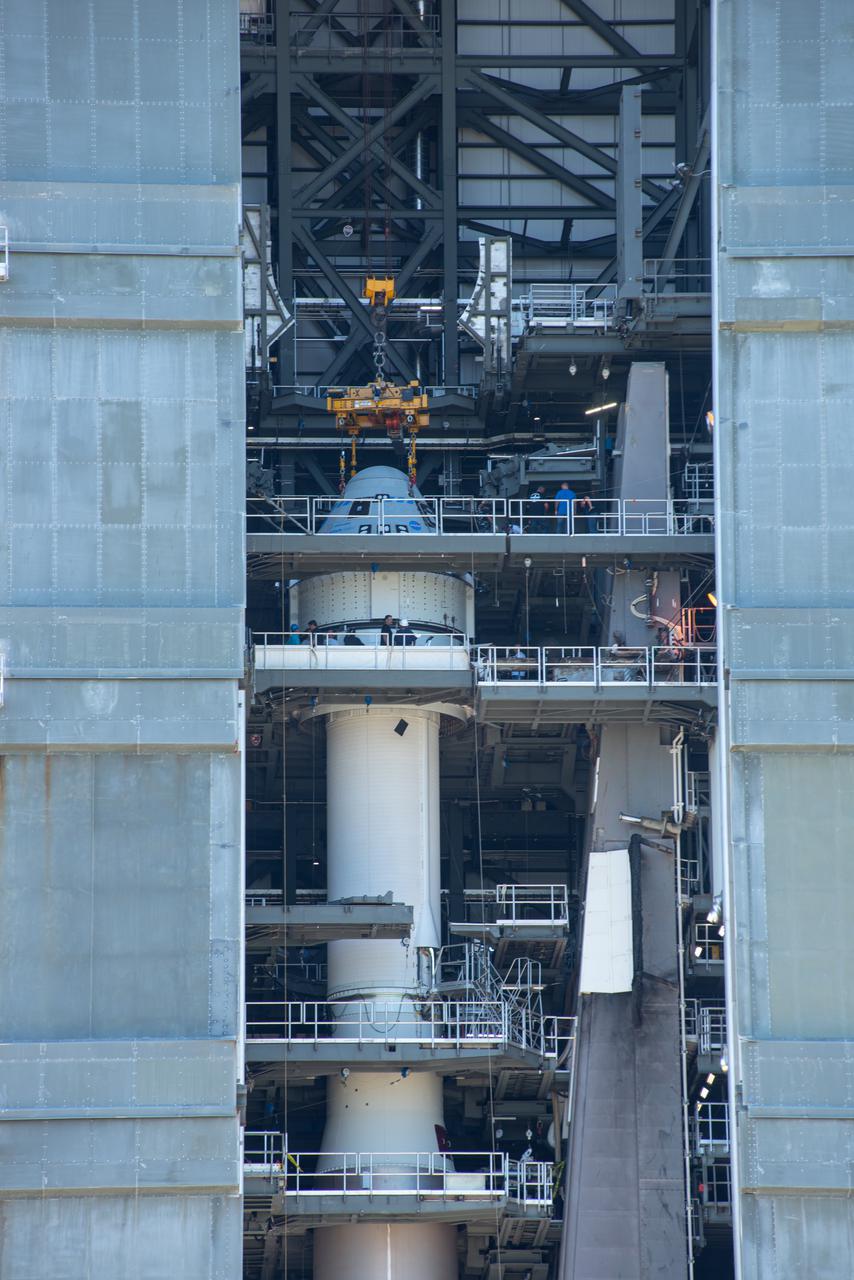 Boeing’s CST-100 Starliner spacecraft is secured atop a United Launch Alliance Atlas V rocket at the Vertical Integration Facility at Space Launch Complex-41 at Florida’s Cape Canaveral Space Force Station on July 17, 2021. Starliner will launch on the Atlas V for Boeing’s second Orbital Flight Test (OFT-2) for NASA’s Commercial Crew Program. The spacecraft rolled out from Boeing’s Commercial Crew and Cargo Processing Facility at NASA’s Kennedy Space Center earlier in the day.
