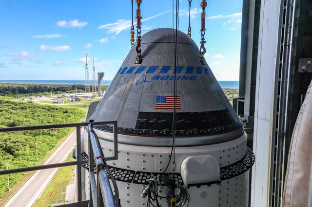 The Boeing CST-100 Starliner spacecraft is secured atop a United Launch Alliance Atlas V rocket at the Vertical Integration Facility at Space Launch Complex 41 at Cape Canaveral Space Force Station in Florida on July 17, 2021. Starliner will launch on the Atlas V for Boeing’s second Orbital Flight Test (OFT-2) for NASA’s Commercial Crew Program. The spacecraft rolled out from Boeing’s Commercial Crew and Cargo Processing Facility at NASA’s Kennedy Space Center earlier in the day.