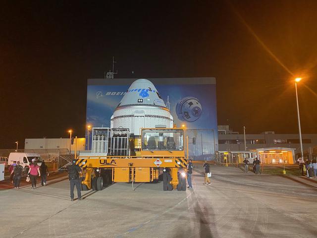 Boeing’s CST-100 Starliner spacecraft rolls out from the company’s Commercial Crew and Cargo Processing Facility at NASA’s Kennedy Space Center in Florida on July 17, 2021. The spacecraft will make the trip to Space Launch Complex-41 at Cape Canaveral Space Force Station where it will be secured atop a United Launch Alliance Atlas V rocket for Boeing’s second Orbital Flight Test (OFT-2) for NASA’s Commercial Crew Program.