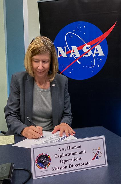 Associate Administrator of the Human Exploration and Operations (HEO) Mission Directorate Kathryn Lueders chaired the Flight Readiness Review for Boeing's upcoming Orbital Flight Test-2 (OFT-2) in Operations Support Building 2 at NASA's Kennedy Space Center in Florida, July 22, 2021. At the conclusion of the meeting, all board members sign the Certificate of Flight Readiness certifying their readiness to proceed to the next milestones and launch of Boeing's CST-100 Starliner atop a United Launch Alliance Atlas V rocket from Space Launch Complex 41 at Cape Canaveral Space Force Station. Launch time remains 2:53 p.m. EDT Friday, July 30 for the uncrewed OFT-2 mission – Starliner's second flight to the International Space Station for NASA's Commercial Crew Program.