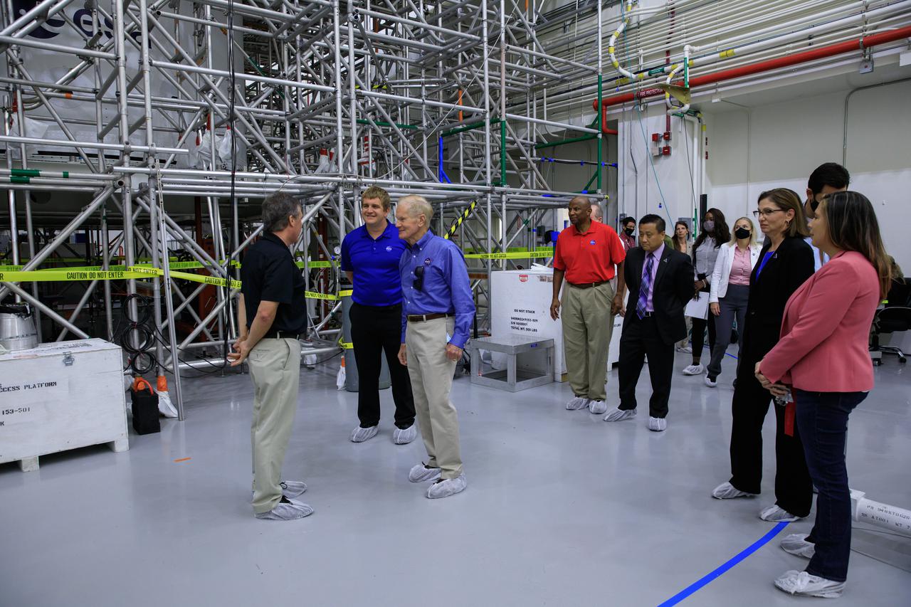 NASA Administrator Bill Nelson, right, tours the Launch Abort System Facility (LASF) during a visit to the agency’s Kennedy Space Center in Florida on July 27, 2021. In the background to the right of Nelson is Kennedy Deputy Director Kelvin Manning. Recently, teams with NASA’s Exploration Ground Systems and contractor Jacobs integrated the launch abort system with the Orion spacecraft inside the LASF as preparations for Artemis I continue. The first in an increasingly complex set of missions, Artemis I will test the Space Launch System rocket and Orion spacecraft as an integrated system prior to crewed flights to the Moon. Through Artemis, NASA will land the first woman and first person of color on the lunar surface, as well as establish a sustainable presence on and around the Moon.