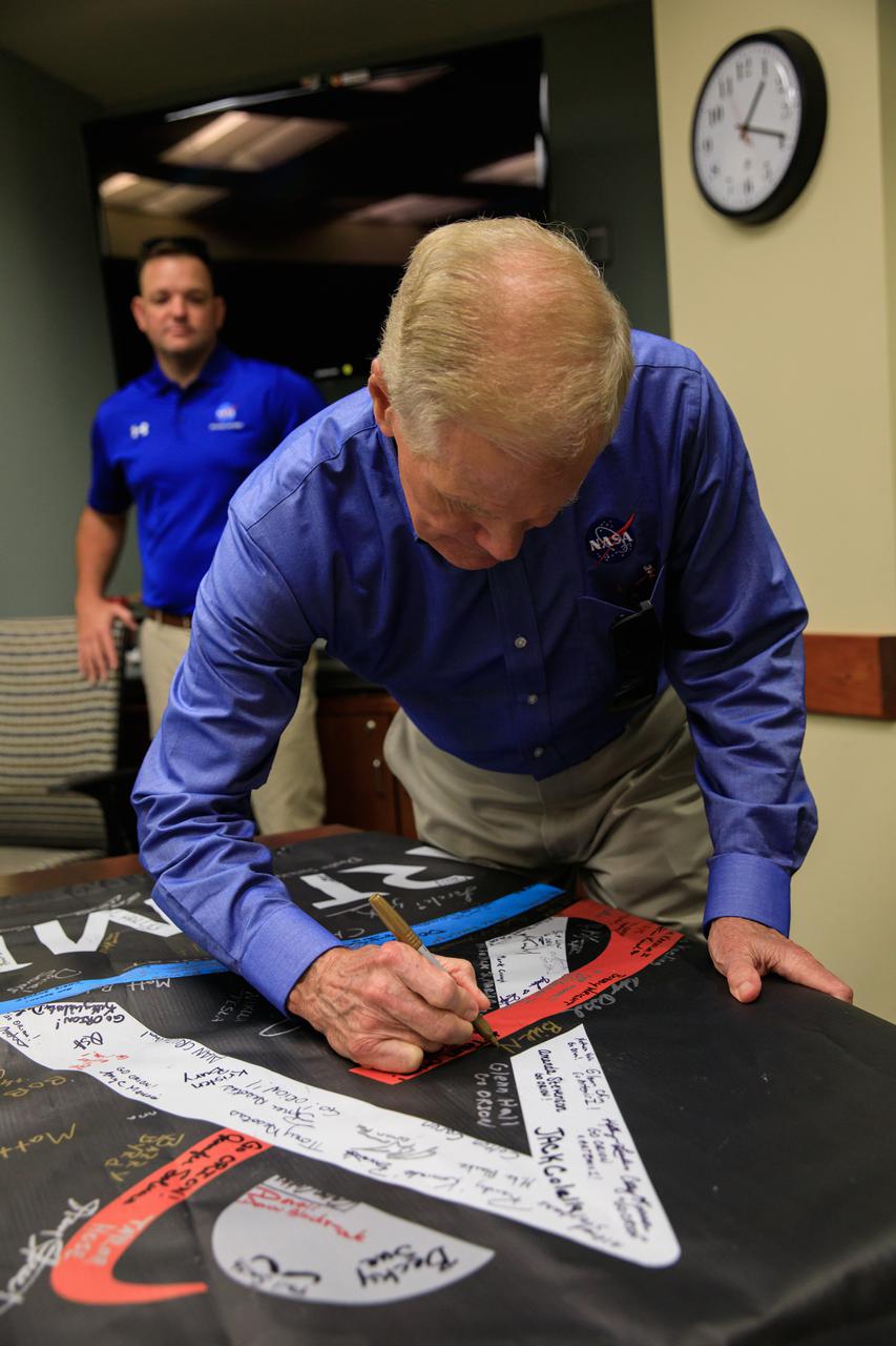 NASA Administrator Bill Nelson adds his signature to an Artemis banner inside the Neil Armstrong Operations and Checkout (O&C) Building during a visit to the agency’s Kennedy Space Center in Florida on July 27, 2021. While at the O&C, Nelson had the opportunity to view some of the flight hardware for Artemis II – the first test flight of the Space Launch System rocket and Orion spacecraft with crew on board. Through Artemis, NASA will land the first woman and first person of color on the lunar surface, as well as establish a sustainable presence on and around the Moon.