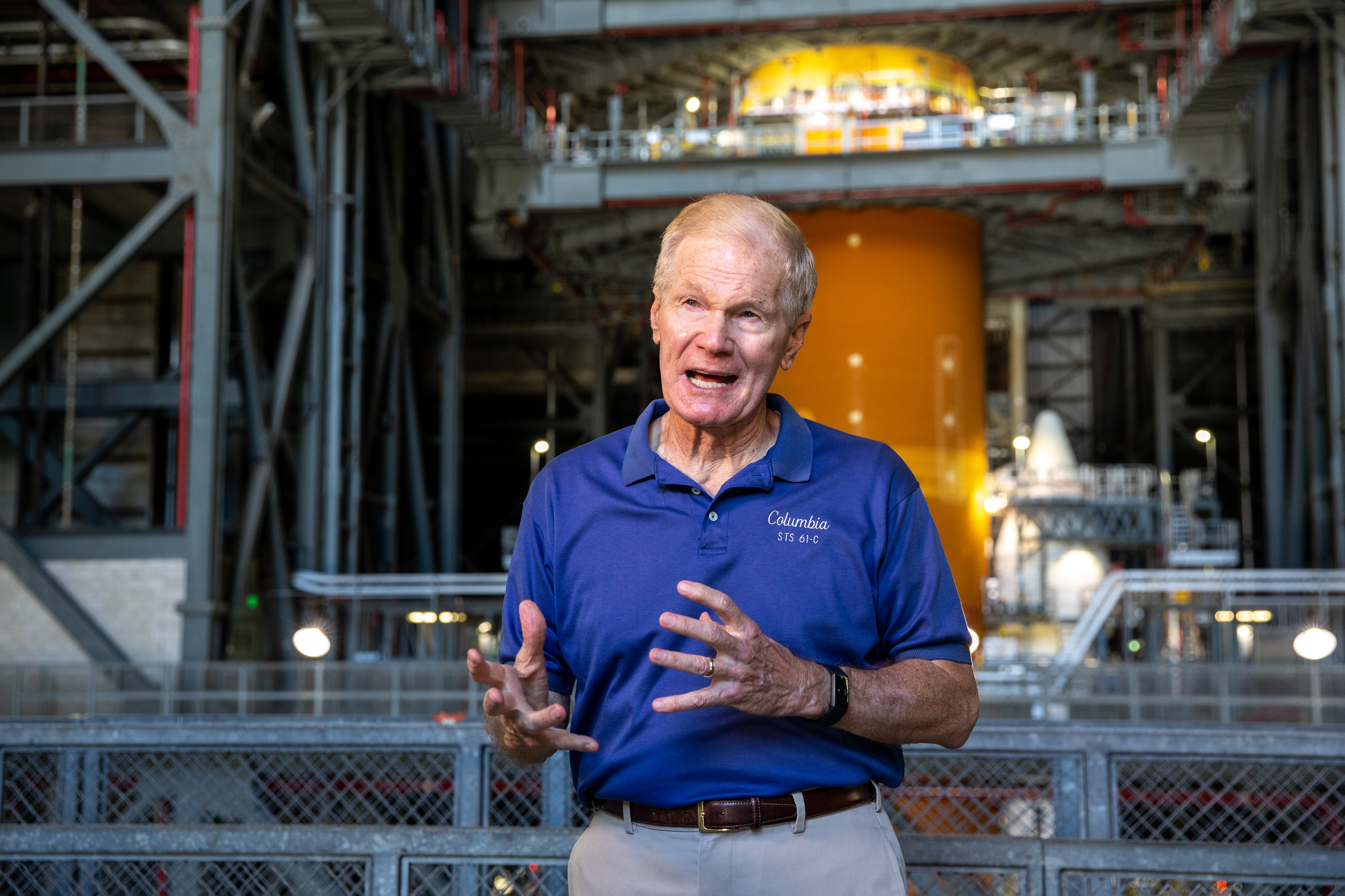 NASA Administrator Bill Nelson participates in an interview inside the Vehicle Assembly Building during a tour and visit to the agency’s Kennedy Space Center in Florida on July 28, 2021. In view in the background is the massive core stage of the Space Launch System (SLS) rocket. The next components to be stacked on top of the rocket are the Orion stage adapter and the spacecraft as preparations for Artemis I continue. The first in an increasingly complex set of missions, Artemis I will test SLS and Orion as an integrated system prior to crewed flights to the Moon. Through Artemis, NASA will land the first woman and first person of color on the lunar surface, as well as establish a sustainable presence on and around the Moon.