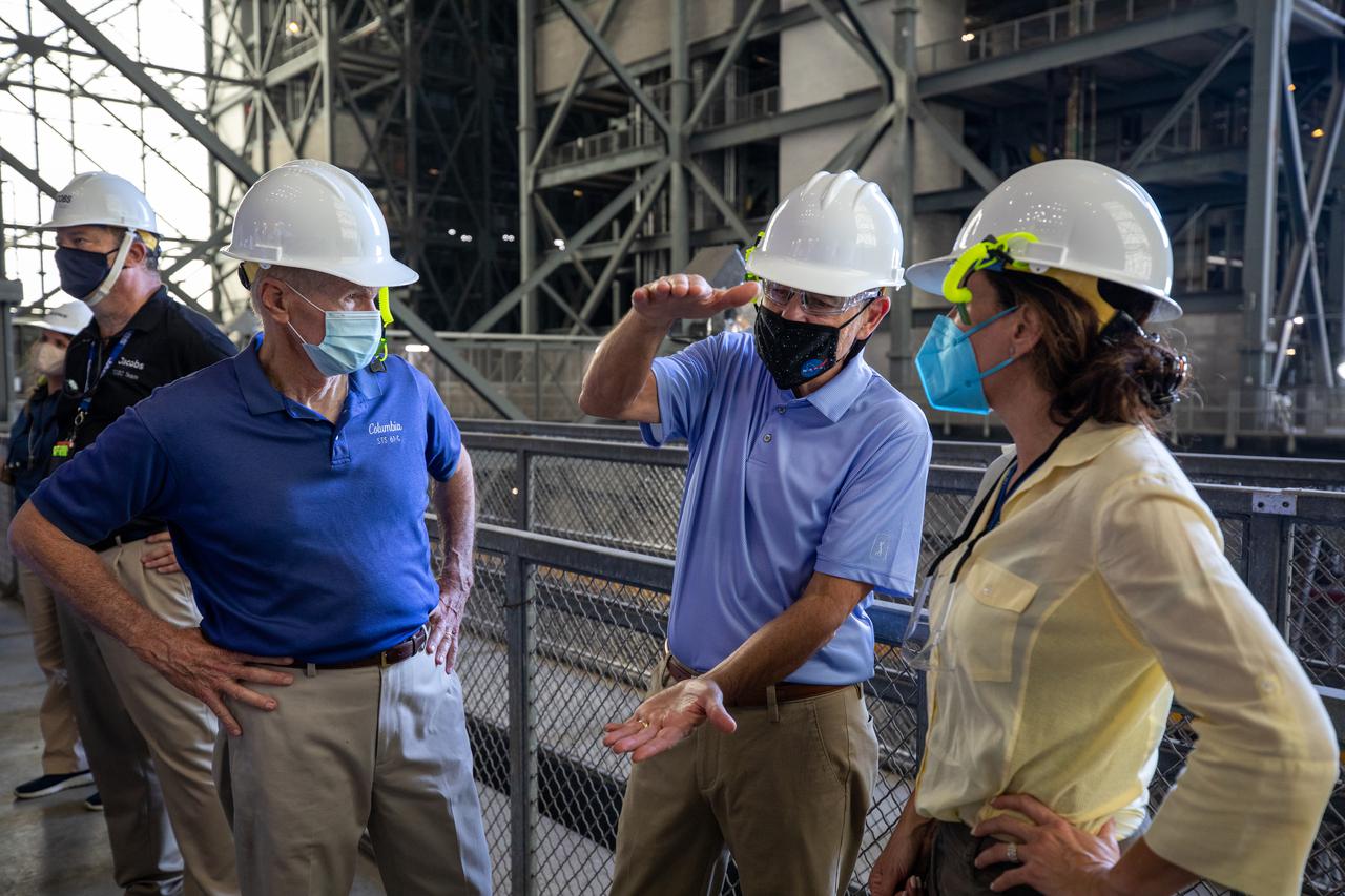 NASA Administrator Bill Nelson, left, tours the Vehicle Assembly Building (VAB) during a visit to the agency’s Kennedy Space Center in Florida on July 28, 2021. In the center is Bob Cabana, NASA associate administrator and former director of Kennedy, and to the right is Susie Perez Quinn, NASA chief of staff. While inside the VAB, Nelson had the opportunity to view the Space Launch System (SLS) rocket as preparations for the Artemis I launch continue. The first in an increasingly complex set of missions, Artemis I will test SLS and Orion as an integrated system prior to crewed flights to the Moon. Through Artemis, NASA will land the first woman and first person of color on the lunar surface, as well as establish a sustainable presence on and around the Moon.