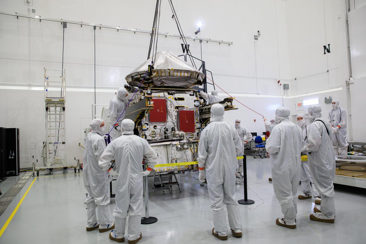Workers assist as a crane lowers the high gain antenna for installation on NASA’s Lucy spacecraft inside the Astrotech Space Operations Facility in Titusville, Florida, on Aug. 6, 2021. Lucy is scheduled to launch no earlier than Saturday, Oct. 16, on a United Launch Alliance Atlas V 401 rocket from Launch Pad 41 at Cape Canaveral Space Force Station. NASA’s Launch Services Program based at Kennedy Space Center is managing the launch. Over its 12-year primary mission, Lucy will explore a record-breaking number of asteroids, flying by one asteroid in the solar system’s main belt and seven Trojan asteroids. Additionally, Lucy’s path will circle back to Earth three times for gravity assists, making it the first spacecraft ever to return to the vicinity of Earth from the outer solar system. 