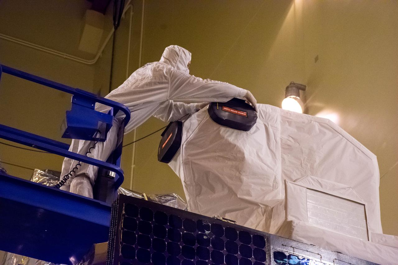 The Landsat 9 instrument cover is removed from the spacecraft inside the Integrated Processing Facility (IPF) at Vandenberg Space Force Base in California.