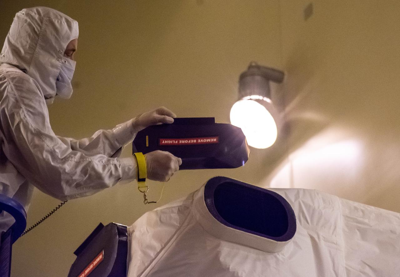 The Landsat 9 instrument cover is removed from the spacecraft inside the Integrated Processing Facility (IPF) at Vandenberg Space Force Base in California.