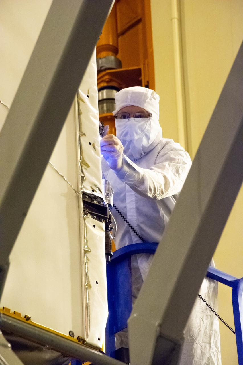 The Landsat 9 instrument cover is removed from the spacecraft inside the Integrated Processing Facility (IPF) at Vandenberg Space Force Base in California.