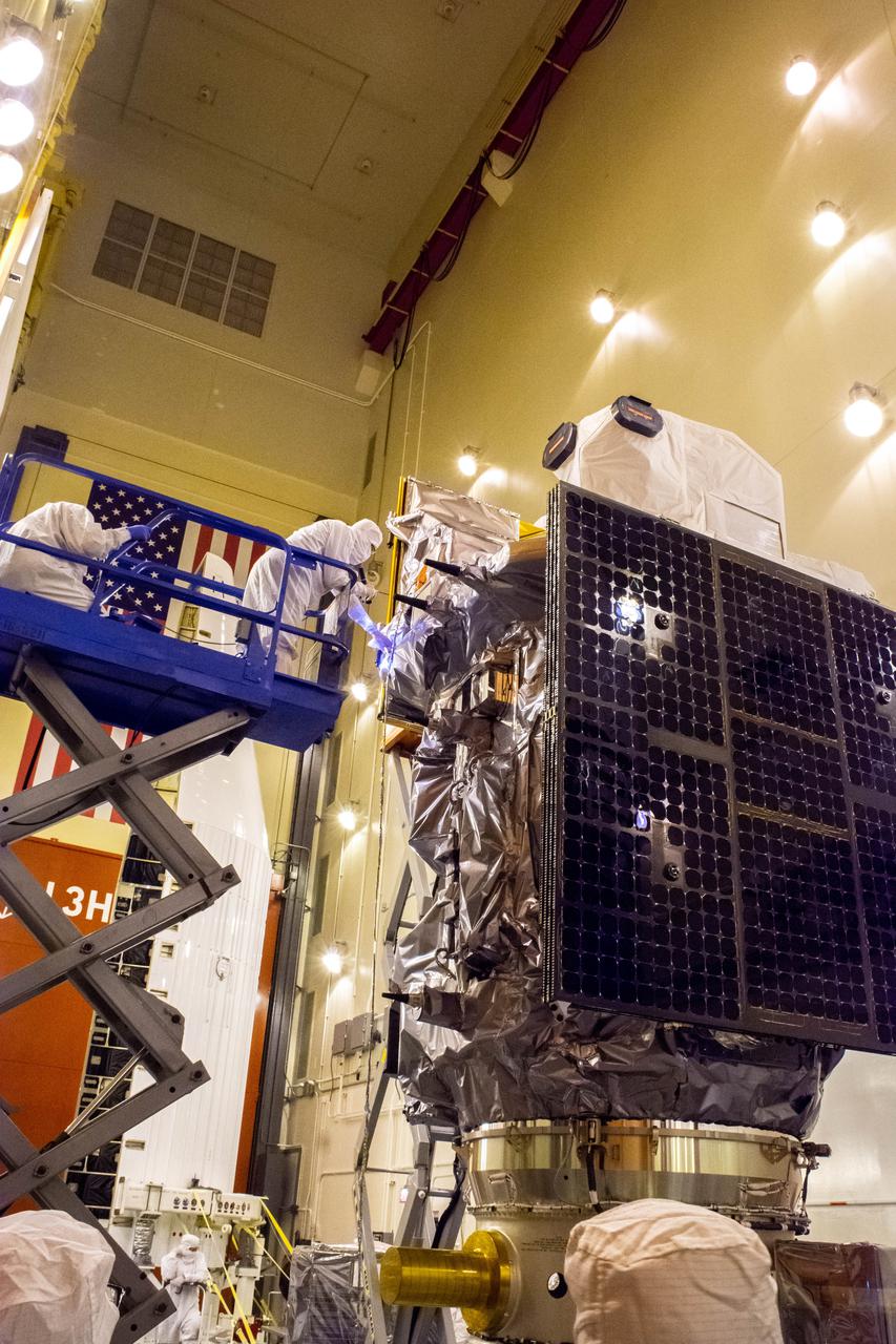 The Landsat 9 instrument cover is removed from the spacecraft inside the Integrated Processing Facility (IPF) at Vandenberg Space Force Base in California.
