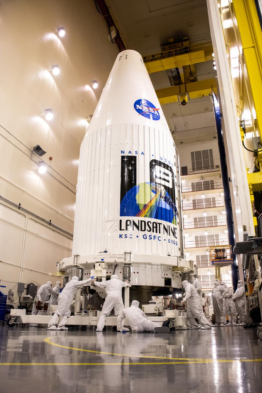 Inside the Integrated Processing Facility at Vandenberg Space Force Base in California, both United Launch Alliance (ULA)  payload fairings are secured around the Landsat 9 spacecraft on Aug. 16, 2021. The fairings will encase and protect Landsat 9 during launch atop the ULA Atlas V rocket. Landsat 9 will launch on the Atlas V rocket from Space Launch Complex 3 at Vandenberg in September 2021. The launch is being managed by NASA’s Launch Services Program based at Kennedy Space Center, America’s multi-user spaceport. The Landsat 9 satellite will continue the nearly 50-year legacy of previous Landsat missions. It will monitor key natural and economic resources from orbit. Landsat 9 is managed by the agency’s Goddard Space Flight Center in Greenbelt, Maryland. The satellite will carry two instruments: the Operational Land Imager 2, which collects images of Earth’s landscapes in visible, near infrared and shortwave infrared light, and the Thermal Infrared Sensor 2, which measures the temperature of land surfaces. Like its predecessors, Landsat 9 is a joint mission between NASA and the U.S. Geological Survey.