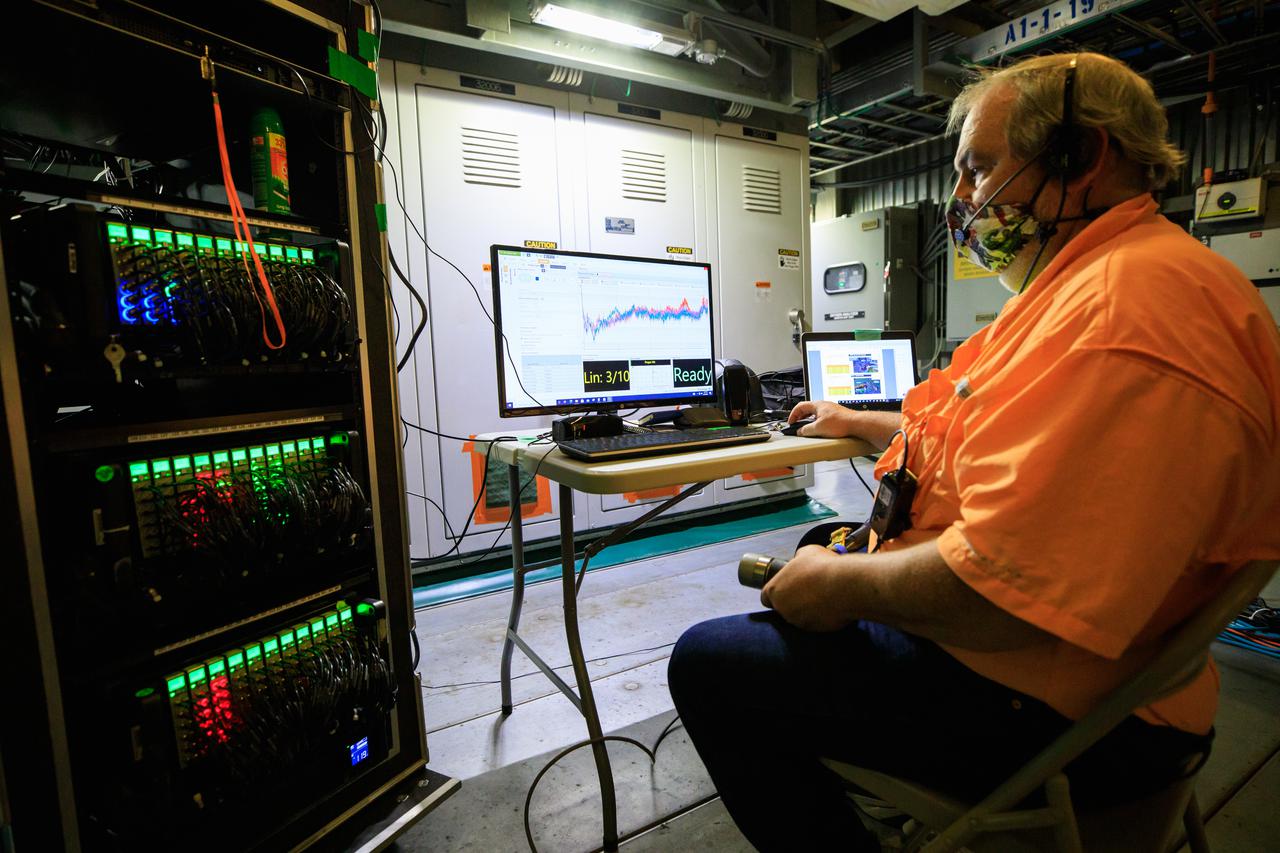 An engineer with contractor Jacobs prepares for a modal tap test on the Space Launch System (SLS) rocket for Artemis I in a room under the zero deck of the mobile launcher inside the Vehicle Assembly Building at NASA’s Kennedy Space Center in Florida on Aug. 16, 2021. The Exploration Ground systems and Jacobs team, along with the SLS team from NASA’s Marshall Space Flight Center in Huntsville, Alabama, are performing the tests with support from personnel at other NASA centers. Engineers are using the mass simulator for Orion and the Orion stage adapter structural test article for the modal test. The tests will determine the different modes of vibration with the recently stacked and integrated SLS rocket before launch of the Artemis I mission. Artemis I will be an uncrewed test of the Orion spacecraft and SLS rocket as an integrated system ahead of crewed flights to the Moon. Under Artemis, NASA aims to land the first woman and first person of color on the Moon and establish sustainable lunar exploration. 