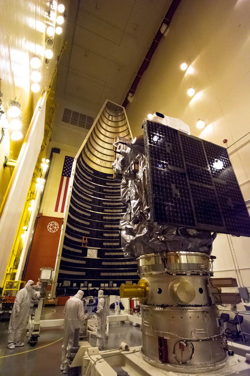 Inside the Integrated Processing Facility at Vandenberg Space Force Base in California, technicians prepare the Landsat 9 spacecraft for encapsulation on Aug. 16, 2021. The two halves of the United Launch Alliance (ULA) payload fairing will surround and encase Landsat 9 to protect it during launch atop the ULA Atlas V rocket. Landsat 9 will launch on the Atlas V rocket from Space Launch Complex 3 at Vandenberg in September 2021. The launch is being managed by NASA’s Launch Services Program based at Kennedy Space Center, America’s multi-user spaceport. The Landsat 9 satellite will continue the nearly 50-year legacy of previous Landsat missions. It will monitor key natural and economic resources from orbit. Landsat 9 is managed by the agency’s Goddard Space Flight Center in Greenbelt, Maryland. The satellite will carry two instruments: the Operational Land Imager 2, which collects images of Earth’s landscapes in visible, near infrared and shortwave infrared light, and the Thermal Infrared Sensor 2, which measures the temperature of land surfaces. Like its predecessors, Landsat 9 is a joint mission between NASA and the U.S. Geological Survey.