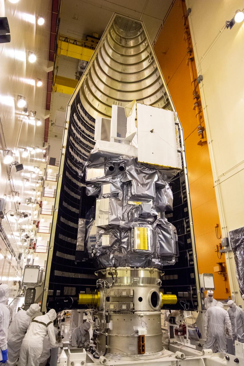 Inside the Integrated Processing Facility at Vandenberg Space Force Base in California, the Landsat 9 spacecraft is moved into position for encapsulation on Aug. 16, 2021. The two halves of the United Launch Alliance (ULA) payload fairing will surround and encase Landsat 9 to protect it during launch atop the ULA Atlas V rocket. Landsat 9 will launch on the Atlas V rocket from Space Launch Complex 3 at Vandenberg in September 2021. The launch is being managed by NASA’s Launch Services Program based at Kennedy Space Center, America’s mult-iuser spaceport. The Landsat 9 satellite will continue the nearly 50-year legacy of previous Landsat missions. It will monitor key natural and economic resources from orbit. Landsat 9 is managed by the agency’s Goddard Space Flight Center in Greenbelt, Maryland. The satellite will carry two instruments: the Operational Land Imager 2, which collects images of Earth’s landscapes in visible, near infrared and shortwave infrared light, and the Thermal Infrared Sensor 2, which measures the temperature of land surfaces. Like its predecessors, Landsat 9 is a joint mission between NASA and the U.S. Geological Survey.