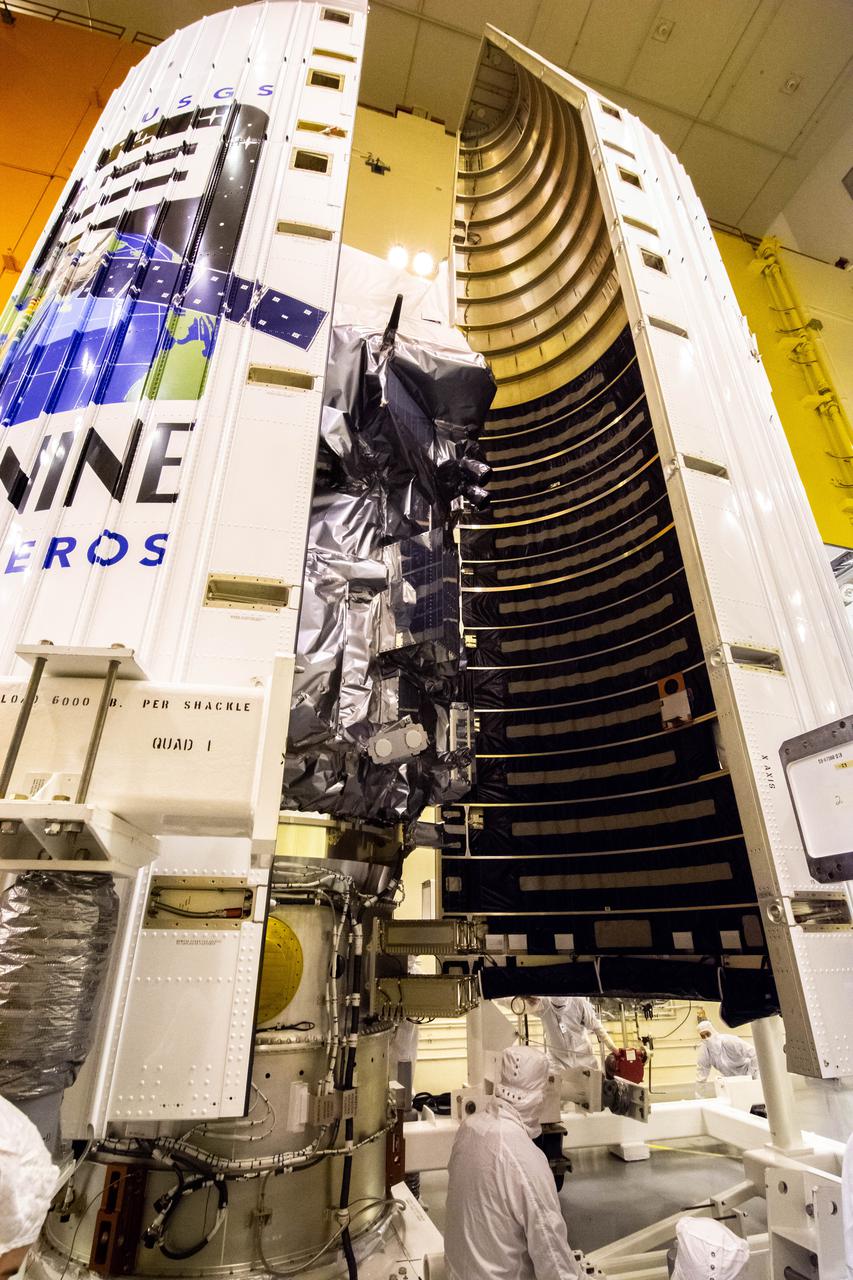 Inside the Integrated Processing Facility at Vandenberg Space Force Base in California, both halves of the United Launch Alliance (ULA) payload fairing are slowly moved around the Landsat 9 spacecraft on Aug. 16, 2021. The payload fairing will be secured around Landsat 9 to protect it during launch atop the ULA Atlas V rocket. Landsat 9 will launch on the Atlas V rocket from Space Launch Complex 3 at Vandenberg in September 2021. The launch is being managed by NASA’s Launch Services Program based at Kennedy Space Center, America’s multi-user spaceport. The Landsat 9 satellite will continue the nearly 50-year legacy of previous Landsat missions. It will monitor key natural and economic resources from orbit. Landsat 9 is managed by the agency’s Goddard Space Flight Center in Greenbelt, Maryland. The satellite will carry two instruments: the Operational Land Imager 2, which collects images of Earth’s landscapes in visible, near infrared and shortwave infrared light, and the Thermal Infrared Sensor 2, which measures the temperature of land surfaces. Like its predecessors, Landsat 9 is a joint mission between NASA and the U.S. Geological Survey. 