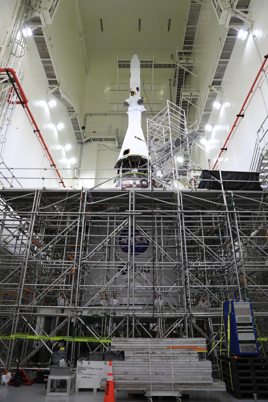 A view of the launch abort system (LAS) for Orion’s Artemis I mission after technicians and engineers with Exploration Ground Systems and Jacobs connected the ogive fairings to it inside the Launch Abort System Facility high bay at NASA’s Kennedy Space Center in Florida on Aug. 20, 2021. The ogives are four protective panels that will shield the crew module from the severe vibrations and sounds it will experience during launch. During Artemis missions, the 44-foot-tall LAS will detach from the spacecraft when it is no longer needed. Launching in 2021, Artemis I will be an uncrewed test of the Orion spacecraft and Space Launch System rocket as an integrated system ahead of crewed flights to the Moon. Under Artemis, NASA aims to land the first woman and first person of color on the Moon and establish sustainable lunar exploration. 