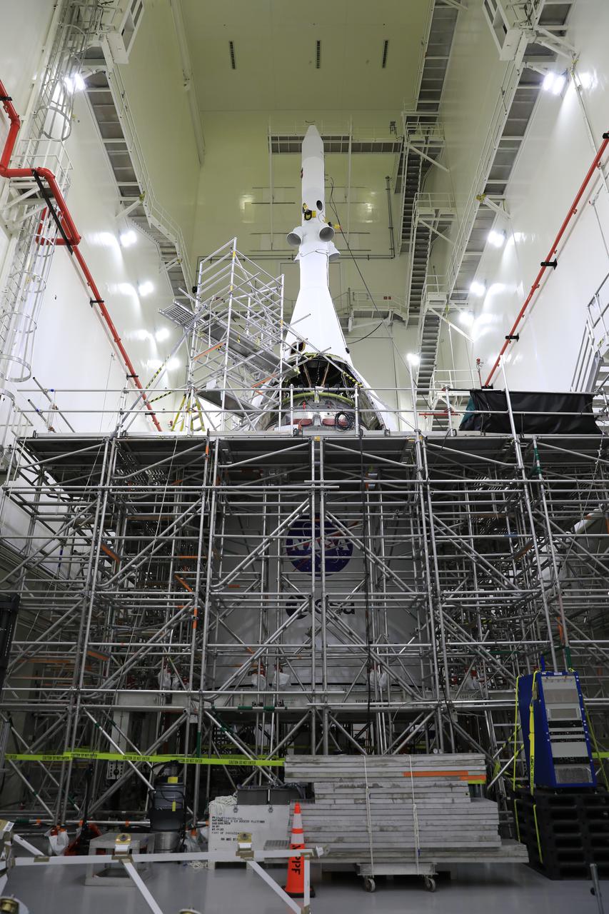 Technicians and engineers with Exploration Ground Systems and Jacobs connect the second ogive fairing for Orion’s Artemis I mission to the launch abort system (LAS) inside the Launch Abort System Facility high bay at NASA’s Kennedy Space Center in Florida on Aug. 23, 2021. The ogives consist of four protective panels that will shield the crew module from the severe vibrations and sounds it will experience during launch. During Artemis missions, the 44-foot-tall LAS will detach from the spacecraft when it is no longer needed. Launching in 2021, Artemis I will be an uncrewed test of the Orion spacecraft and Space Launch System rocket as an integrated system ahead of crewed flights to the Moon. Under Artemis, NASA aims to land the first woman and first person of color on the Moon and establish sustainable lunar exploration.