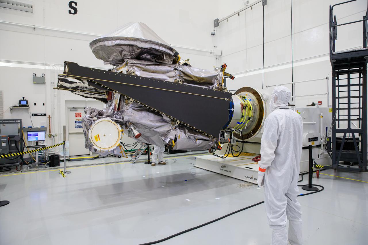 NASA’s Lucy spacecraft is moved to the horizontal position on a rotation stand inside the Astrotech Space Operations Facility in Titusville, Florida, on Sept. 1, 2021. In view, the high gain antenna and solar arrays have been installed on the Lucy spacecraft. Lucy is scheduled to launch no earlier than Saturday, Oct. 16, on a United Launch Alliance Atlas V 401 rocket from Launch Pad 41 at Cape Canaveral Space Force Station. NASA’s Launch Services Program based at Kennedy Space Center is managing the launch. Over its 12-year primary mission, Lucy will explore a record-breaking number of asteroids, flying by one asteroid in the solar system’s main belt and seven Trojan asteroids. Additionally, Lucy’s path will circle back to Earth three times for gravity assists, making it the first spacecraft ever to return to the vicinity of Earth from the outer solar system. 