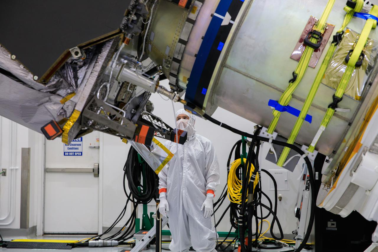 A close-up view of NASA’s Lucy spacecraft secured on a rotation stand inside the Astrotech Space Operations Facility in Titusville, Florida, on Sept. 1, 2021. Lucy is scheduled to launch no earlier than Saturday, Oct. 16, on a United Launch Alliance Atlas V 401 rocket from Launch Pad 41 at Cape Canaveral Space Force Station. NASA’s Launch Services Program based at Kennedy Space Center is managing the launch. Over its 12-year primary mission, Lucy will explore a record-breaking number of asteroids, flying by one asteroid in the solar system’s main belt and seven Trojan asteroids. Additionally, Lucy’s path will circle back to Earth three times for gravity assists, making it the first spacecraft ever to return to the vicinity of Earth from the outer solar system. 