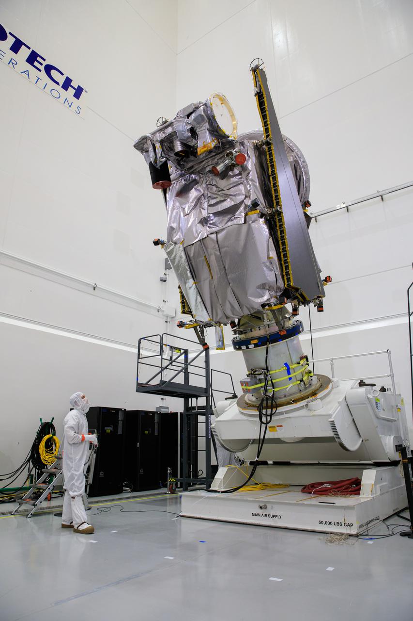 NASA’s Lucy spacecraft is moved to the vertical position on a rotation stand inside the Astrotech Space Operations Facility in Titusville, Florida, on Sept. 1, 2021. In view, the high gain antenna and solar arrays have been installed on the Lucy spacecraft. Lucy is scheduled to launch no earlier than Saturday, Oct. 16, on a United Launch Alliance Atlas V 401 rocket from Launch Pad 41 at Cape Canaveral Space Force Station. NASA’s Launch Services Program based at Kennedy Space Center is managing the launch. Over its 12-year primary mission, Lucy will explore a record-breaking number of asteroids, flying by one asteroid in the solar system’s main belt and seven Trojan asteroids. Additionally, Lucy’s path will circle back to Earth three times for gravity assists, making it the first spacecraft ever to return to the vicinity of Earth from the outer solar system. 