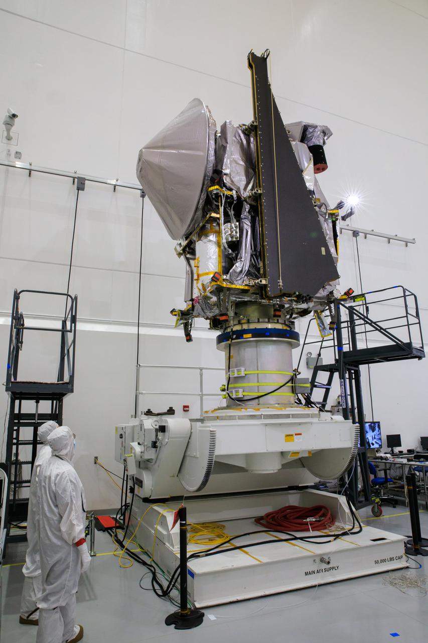 NASA’s Lucy spacecraft is moved to the vertical position on a rotation stand inside the Astrotech Space Operations Facility in Titusville, Florida, on Sept. 1, 2021. In view, the high gain antenna and solar arrays have been installed on the Lucy spacecraft. Lucy is scheduled to launch no earlier than Saturday, Oct. 16, on a United Launch Alliance Atlas V 401 rocket from Launch Pad 41 at Cape Canaveral Space Force Station. NASA’s Launch Services Program based at Kennedy Space Center is managing the launch. Over its 12-year primary mission, Lucy will explore a record-breaking number of asteroids, flying by one asteroid in the solar system’s main belt and seven Trojan asteroids. Additionally, Lucy’s path will circle back to Earth three times for gravity assists, making it the first spacecraft ever to return to the vicinity of Earth from the outer solar system.
